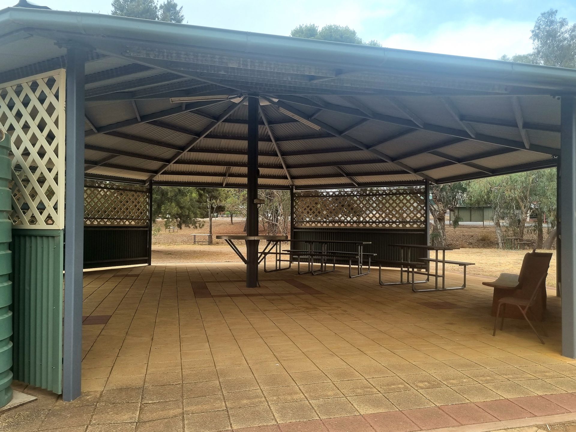 Large partially enclosed rotunda with seating for public use.