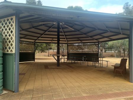 Large partially enclosed rotunda with seating for public use.
