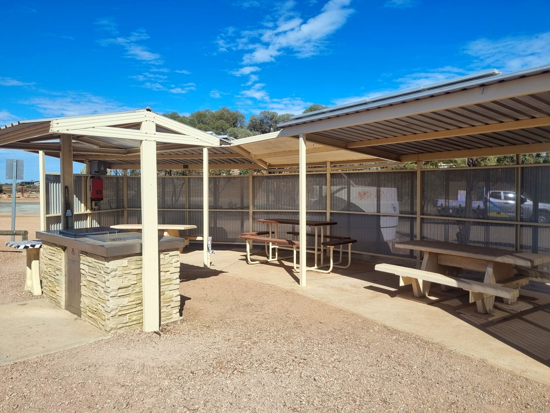 Public barbeque and seating under seperate shelters at Weeroona Island.